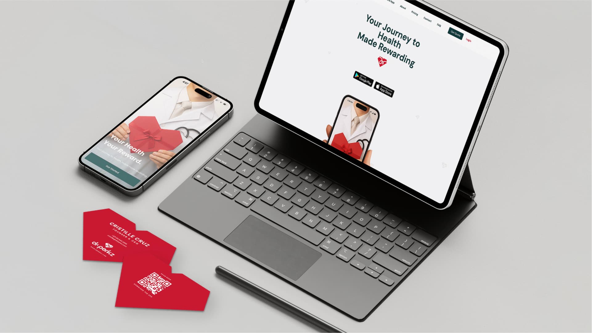 Dr.Perkz app and website shown on a phone and tablet beside heart-shaped die-cut business cards in cherry red